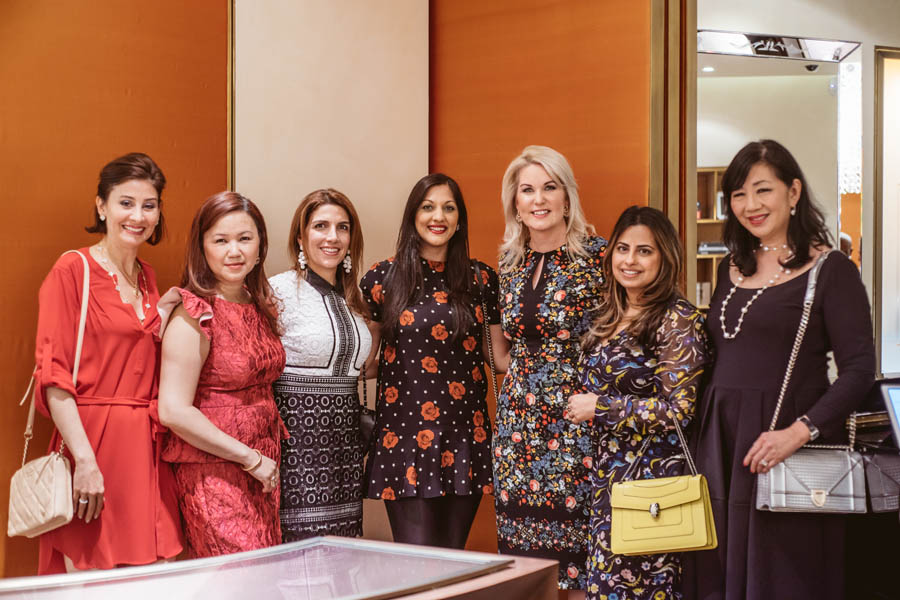 Stephanie Von Stein, Dr. Sippi Khurana, and others posing for a photo at the Bulgari Galleria in Houston supporting KNOWAutism